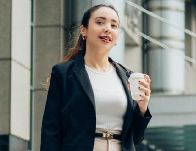 Women holding coffee cup
